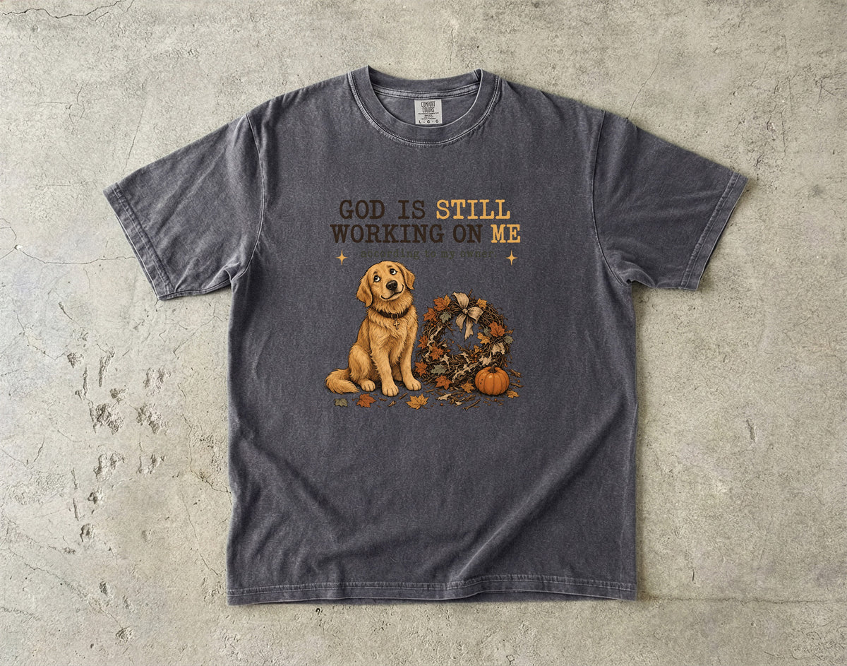 God Is Still Working On Me According To My Owner Funny Christian Dog Shirt | Golden Retriever Fall Faith Tee | Funny Dog Mom Christian Shirt