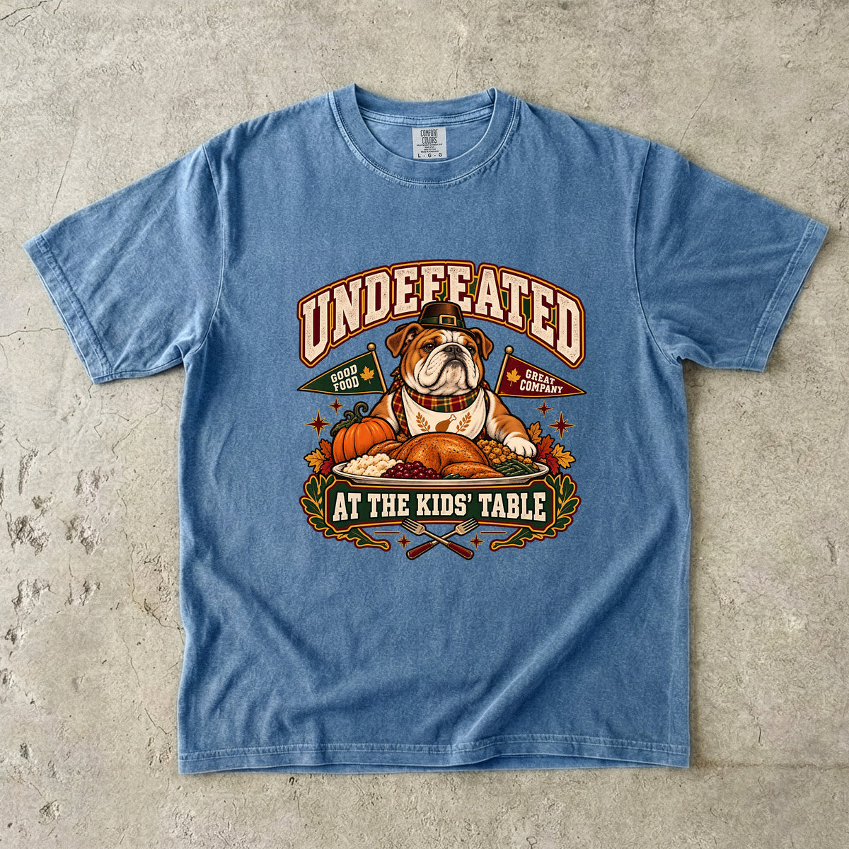 Undefeated at the Kids' Table Funny Thanksgiving T-Shirt | Vintage Bulldog Family Dinner Tee | Comfort Colors 1717 Garment-Dyed Unisex Shirt | Dog Lover Gift